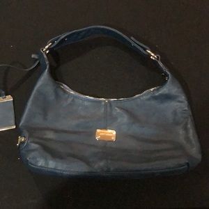 Beautiful jimmy Choo purse. Blue with gold accents. Item is in great shape.